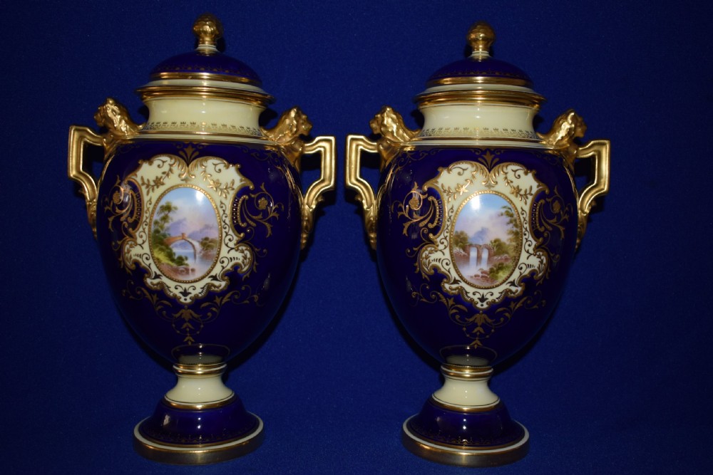 coalport pair of hand painted vases and covers
