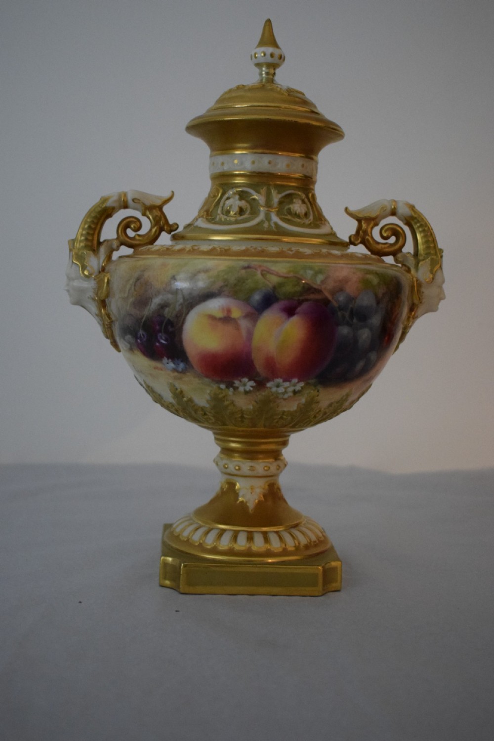 royal worcester painted fruit angel head vase and cover by ricketts
